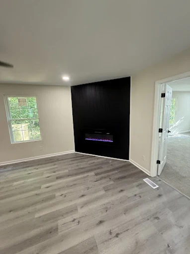 New flooring and fireplace feature wall